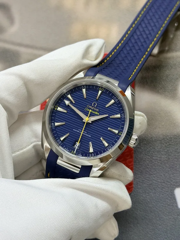VSF Aqua Terra 41 mm, blue teak-pattern dial, yellow seconds hand, blue rubber strap, angled view