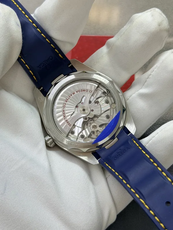 VSF Aqua Terra 41 mm, blue teak-pattern dial, yellow seconds hand, blue rubber strap, display caseback with movement