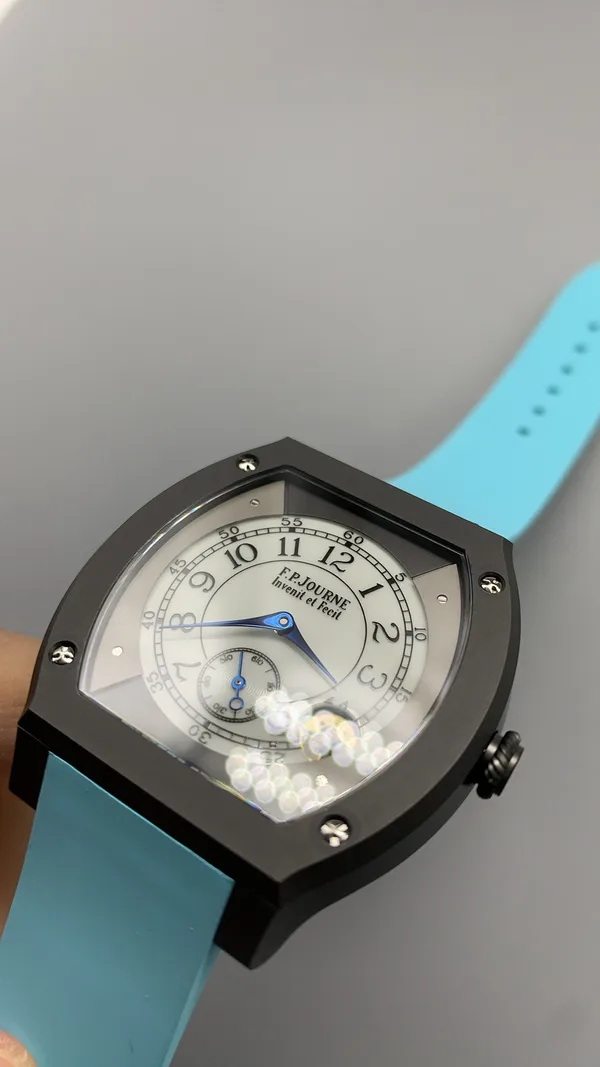 Élégante 48 mm replica, white dial, dark case, sky blue rubber strap
