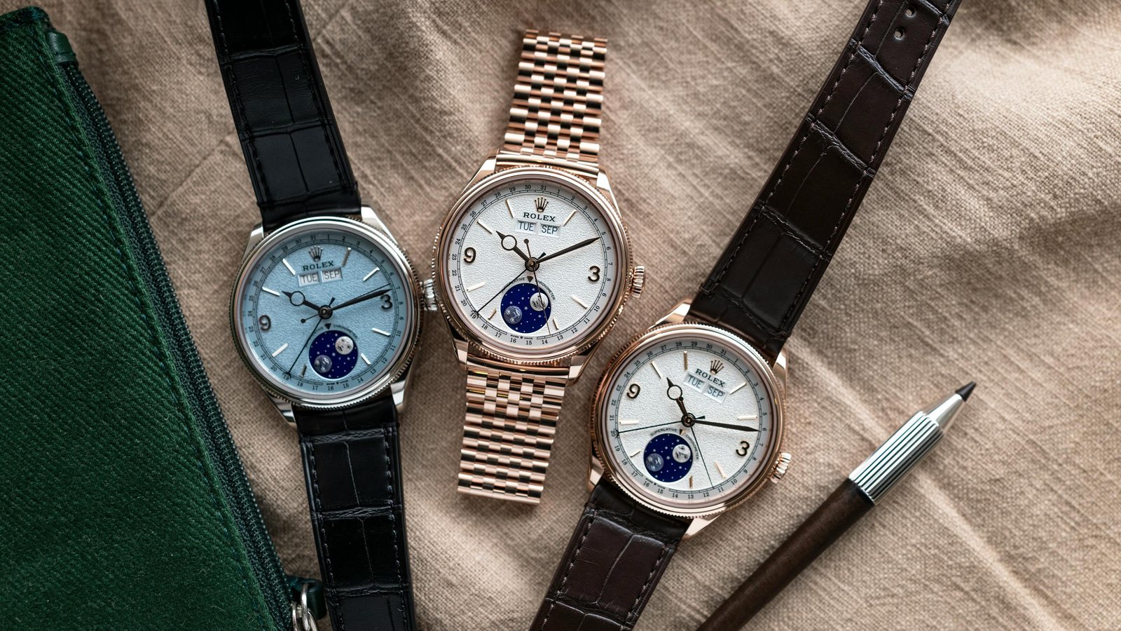 Three Rolex annual-calendar watches with moonphase dials