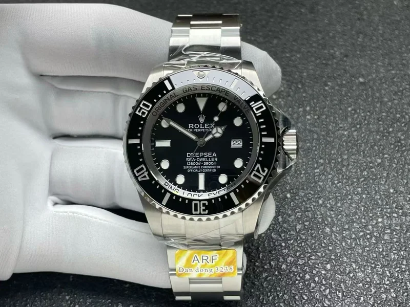 Black dial and black ceramic bezel, front view, factory tag on the bracelet