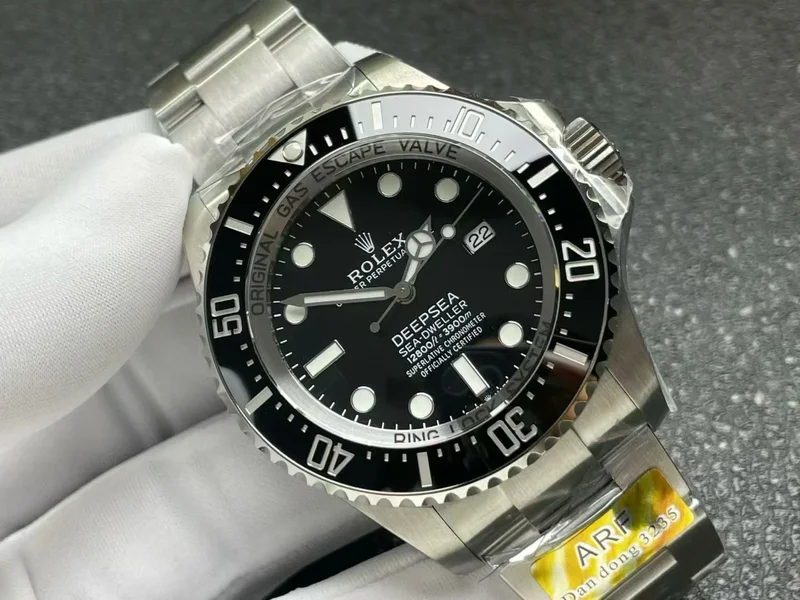 Black dial at an angle, catching the ceramic bezel and the inner ring text