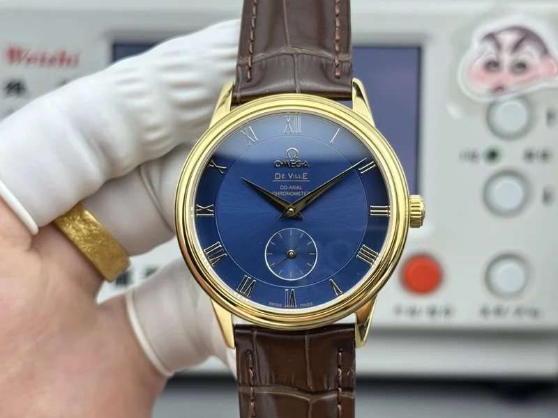 Blue dial with gold-tone Roman numerals, yellow-gold-tone case, brown alligator-pattern strap, front view