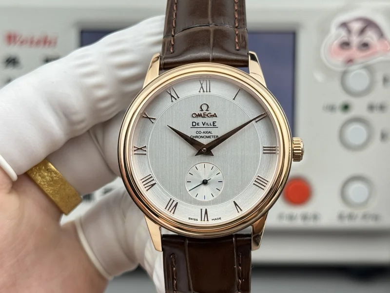 Silver vertically brushed dial with rose-gold-tone numerals, rose-gold-tone case, brown alligator-pattern strap, front view