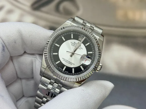 JR Datejust 36 116234, black and white tuxedo dial, fluted bezel, dial, angled from the right