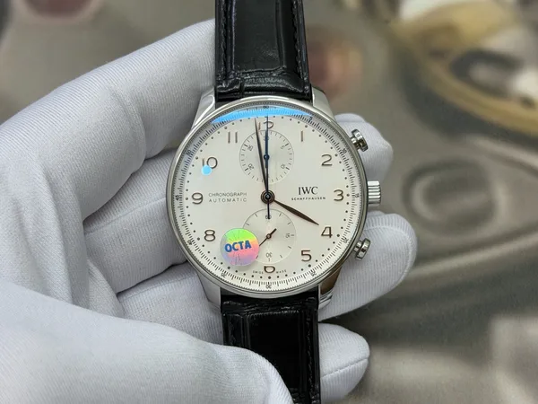 OCTA Portugieser Chronograph, silver dial with gold hands, black leather strap, dial view