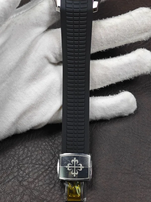 Black textured strap leading to the fold-over clasp
