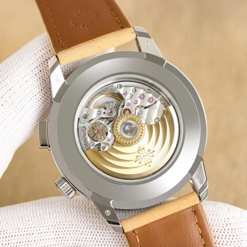 Caseback with the exhibition window, gold-toned central rotor and beige strap