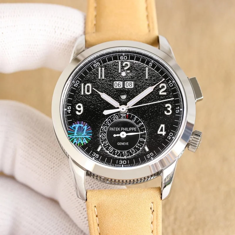 Black dial, front view, on a tan suede strap, with a hologram sticker on the crystal