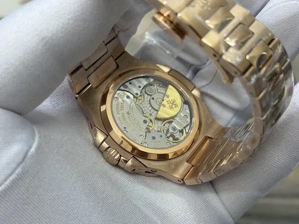UMI Nautilus 5712/1R, brown dial, gold-plated bracelet, display caseback and micro-rotor