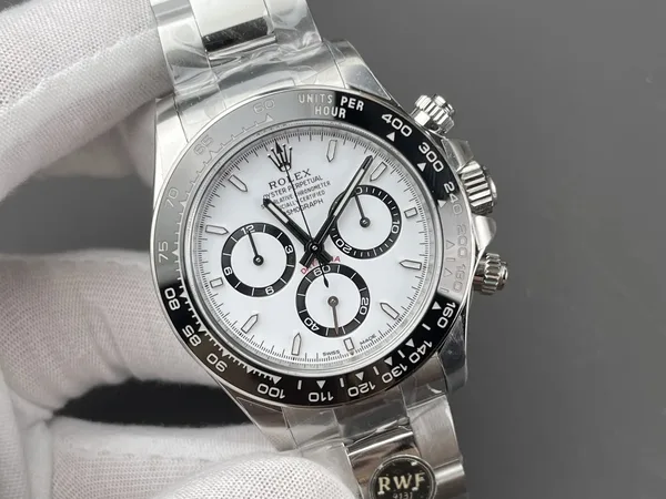 RW Factory Daytona 126500LN Panda, white dial, black ceramic bezel, held in a gloved hand, dial close-up