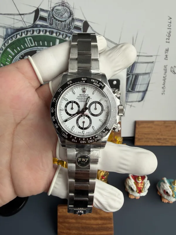 RW Factory Daytona 126500LN Panda, white dial, held in a gloved hand, front view