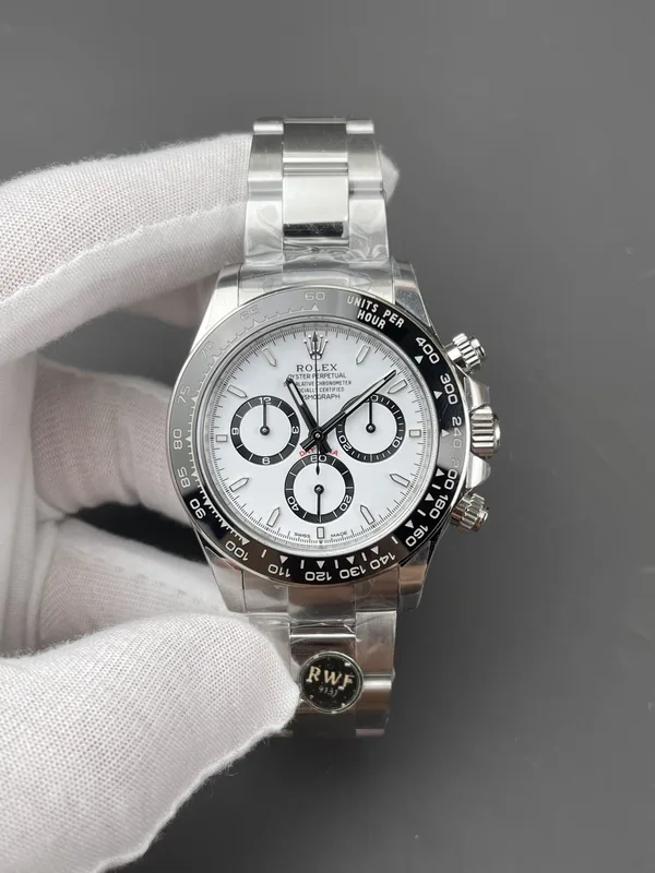 RW Factory Daytona 126500LN Panda, white dial, held in a gloved hand