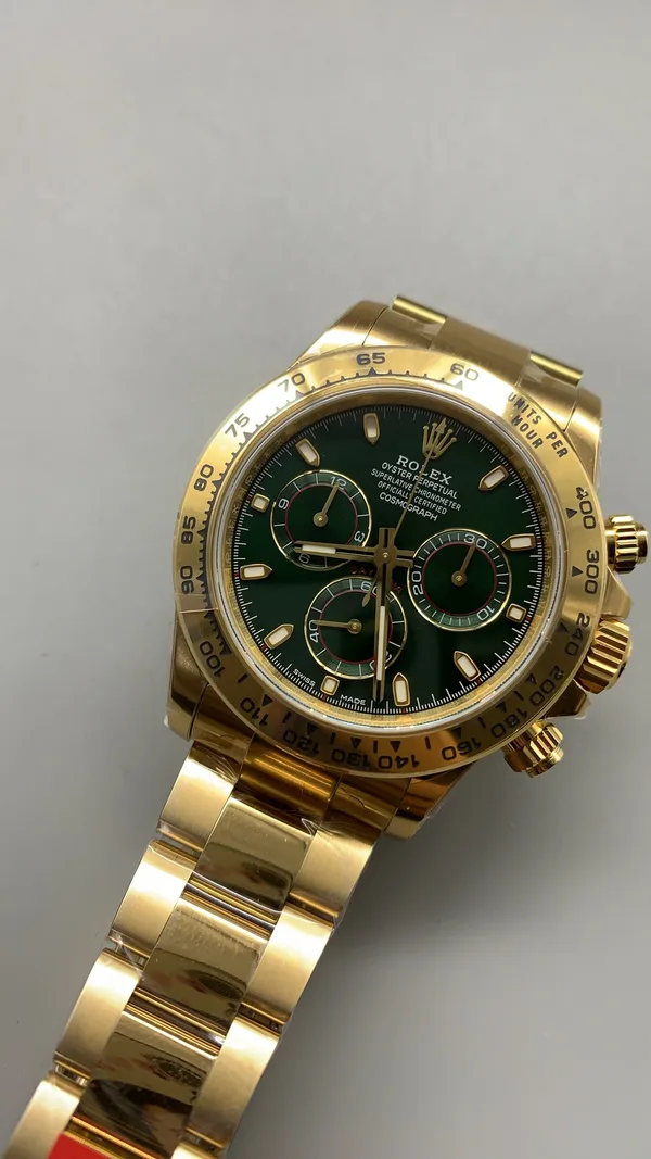 VSF Daytona 116508, green dial, yellow-gold-tone case, dial, angled