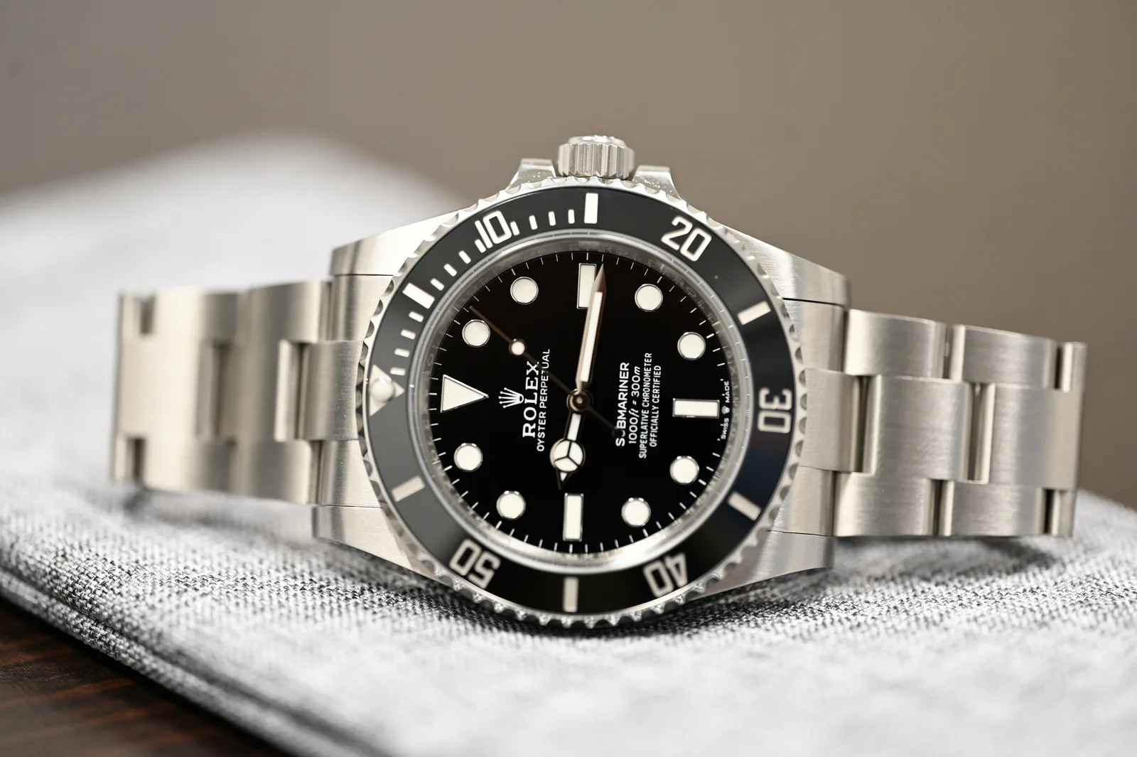 VSF Submariner No Date 124060 at an angle on a grey cloth, showing the case side and bezel